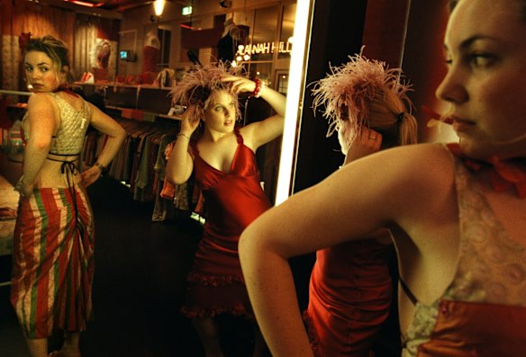 School students trying on outfits for their school formal at Alannah Hill shop at The Strand Arcade, 2000.