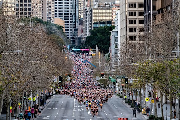 Runners head down Williams Street at the start of the City2Surf.
