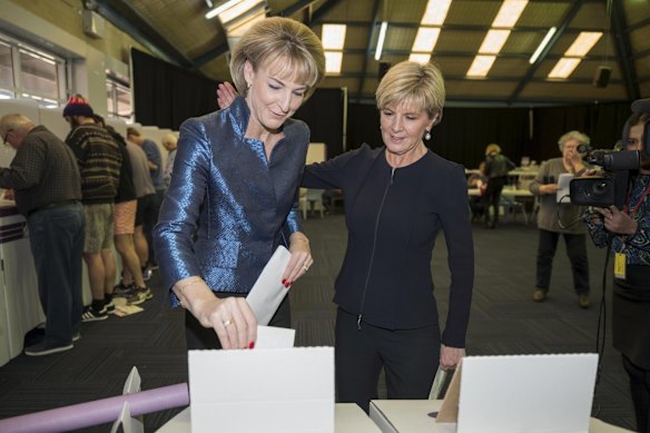 Julie Bishop watches as Michaelia Cash casts her vote at the Swanbourne Primary school, polling place in Western Australia.