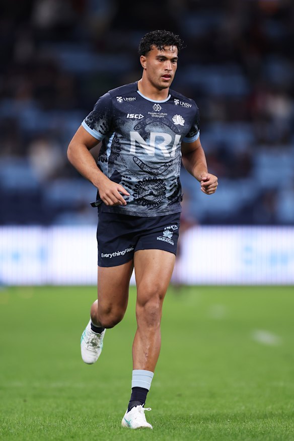 Joseph-Aukuso Suaalii warms up. 