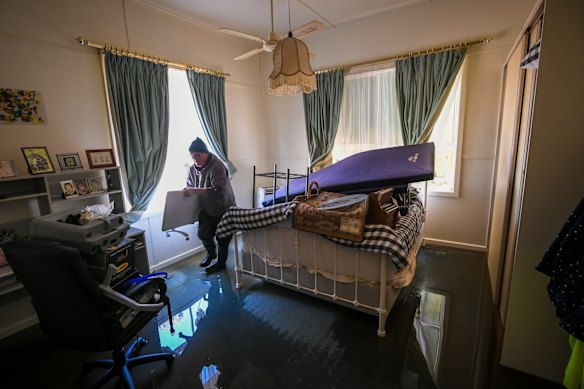 Brian removes heaters from the master bedroom.