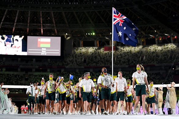 Flag bearers Cate Campbell and Patty Mills of Team Australia lead their team out during the Opening Ceremony of the Tokyo 2020 Olympic Games at Olympic Stadium on July 23, 2021 in Tokyo, Japan. 