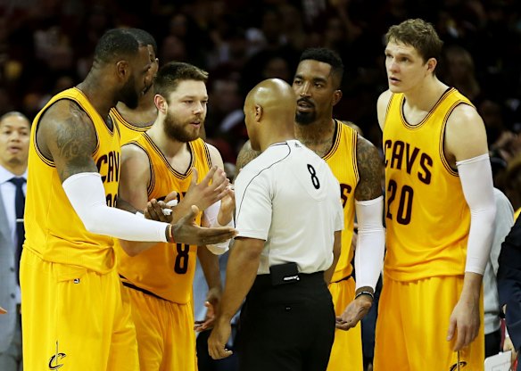 Matthew Dellavedova's game-three starring role: Dellavedova, LeBron James, JR Smith and Timofey Mozgov argue a decision with referee Marc Davis.