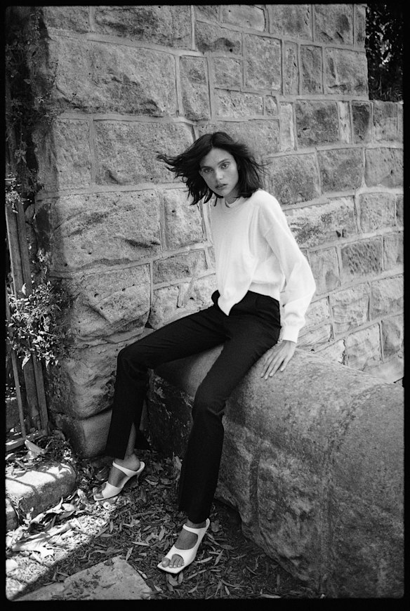 Sportmax sweater, $1195. Rebecca Vallance  “Ryder” pants, $399. Bottega Veneta sandals, $1190.