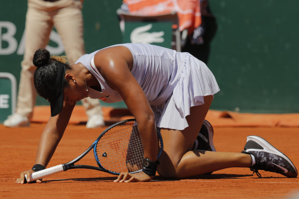 Japan's Naomi Osaka gets up after slipping during her third round match of the French Open.