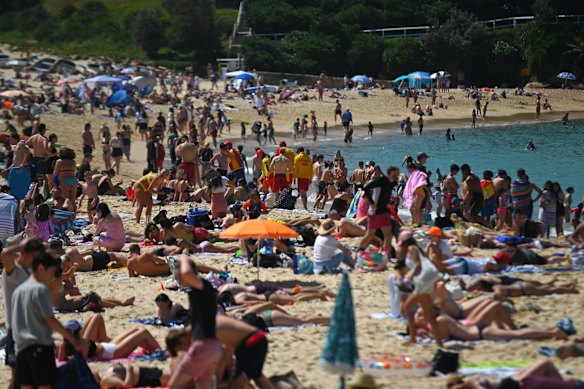 A crowded Coogee Beach today as above average temperatures and single digit or zero positive transmissions over the past fortnight in NSW has drawn people out.