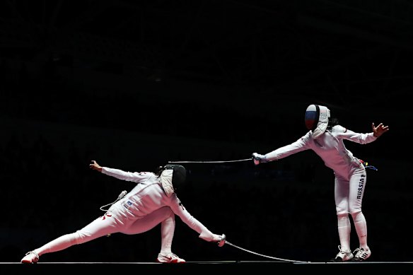 Lyubov Shutova of Russia in action against Man Wai Vivian Kong of China during the women's individual epee fencing.