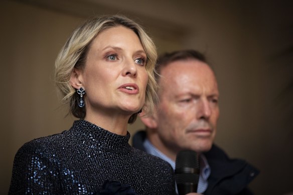 Katherine Deves, the Liberal candidate for the Sydney seat of Warringah, concedes defeat to independant Zali Steggall as former prime minister Tony Abbott watches on.