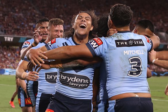 Jerome Luai of the Blues celebrates with team mates after a try scored by Brian To'o of the Blues during game one of the 2021 State of Origin series.