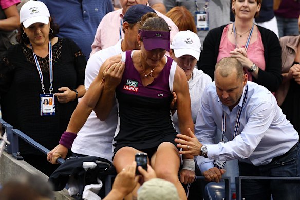 Samantha Stosur of Australia jumps down from her player box after defeating Serena Williams  to win the US Open women's singles title.