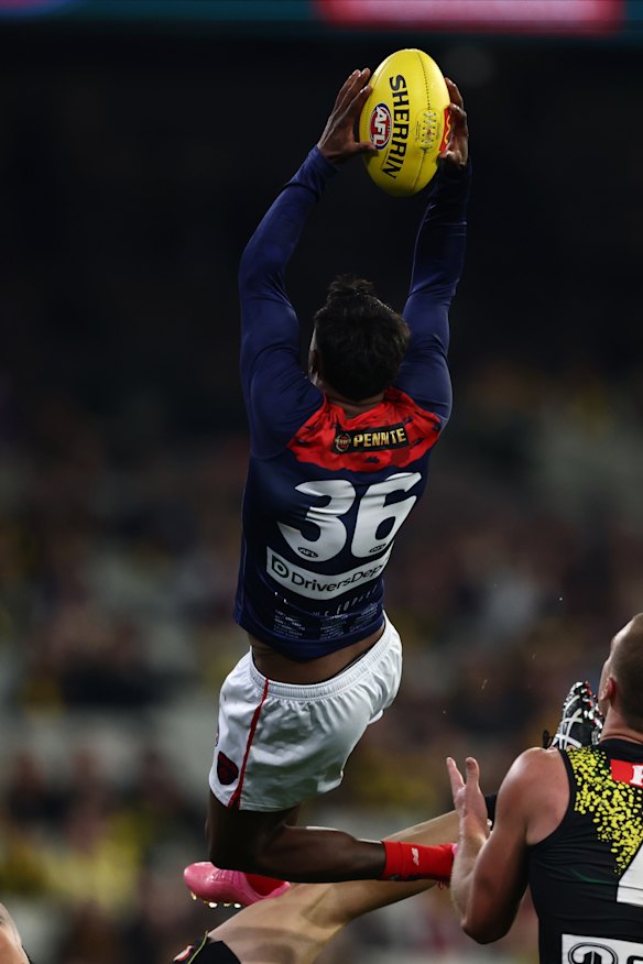Kysaiah Pickett of the Demons marks the ball.