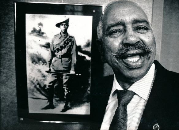 Reg Saunders with a picture of his father Chris.