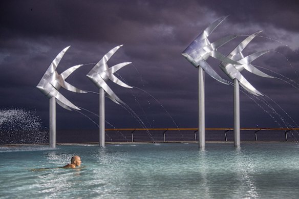 A lone swimmer in the iconic Cairns lagoon on the Esplanade once crowded with International and Australian tourists.