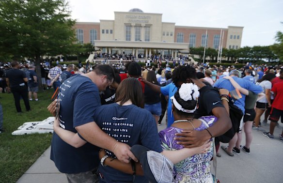 People pray during "A Gathering of Our Collin County Churches," at the Collin County Courthouse in McKinney, Texas.