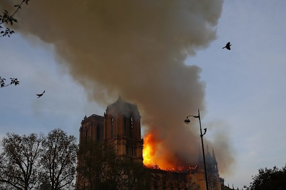 Tourists and Parisians looked on aghast from the streets below.