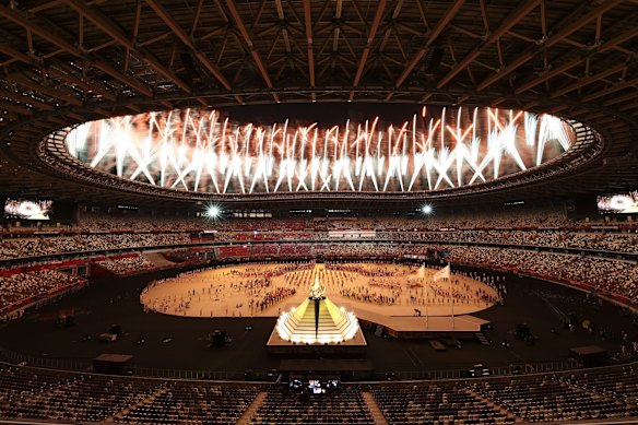 General view inside the stadium as fireworks go off during the lighting of the Olympic cauldron.