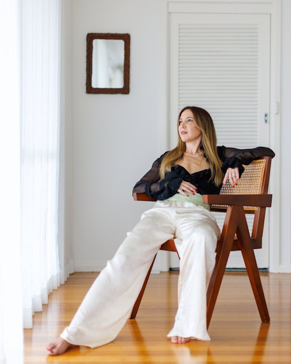 Stylist Jade Fox wears a vintage Gucci blouse and Harris Tapper trousers with a foam green lace offcut fashioned into a cummerbund.