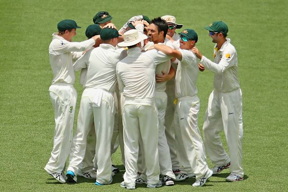 Mitchell Johnson and the Australians celebrate the wicket of Kevin Pietersen.