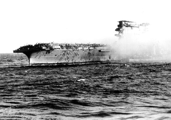  In this 1942 file photo, crew abandons the USS Lexington after the decks of the aircraft carrier sunk in the Battle of the Coral Sea during World War II