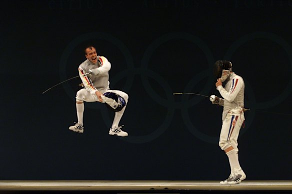 Ralf Bissdorf from Germany celebrates winning against Jean-Noel Ferrari from France in the semi-final of the men's individual foil.
