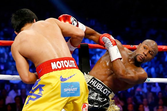 Floyd throws a right at Manny.