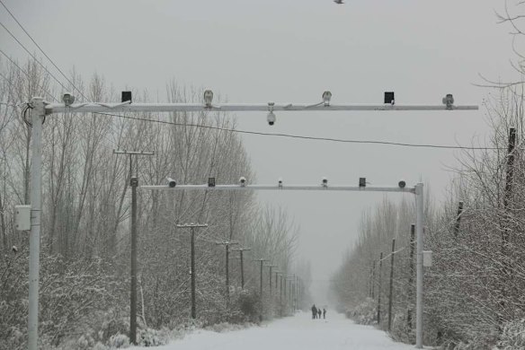 Surveillance cameras keep watch on the roads entering Pilal village, in Akto county.