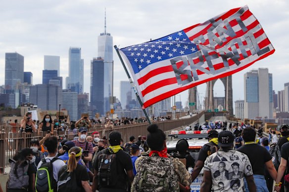 Protesters march on the Brooklyn Bridge after a rally in Cadman Plaza Park.