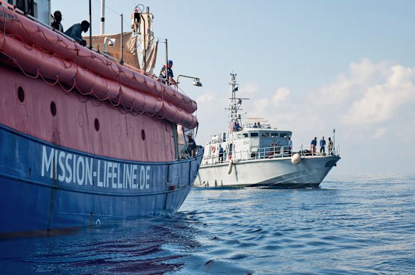 Lifeline is reached by a Libyan Coast Guard boat after rescuing migrants from a rubber boat in the Mediterranean Sea.