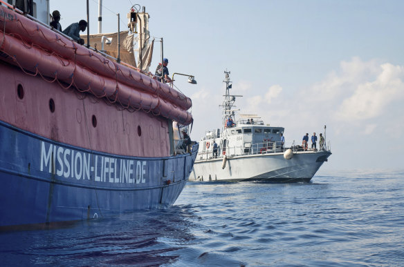 Lifeline is reached by a Libyan Coast Guard boat after rescuing migrants from a rubber boat in the Mediterranean Sea.