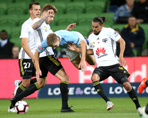 Let me at it: Melbourne City's Riley McGree fights for the ball last night.