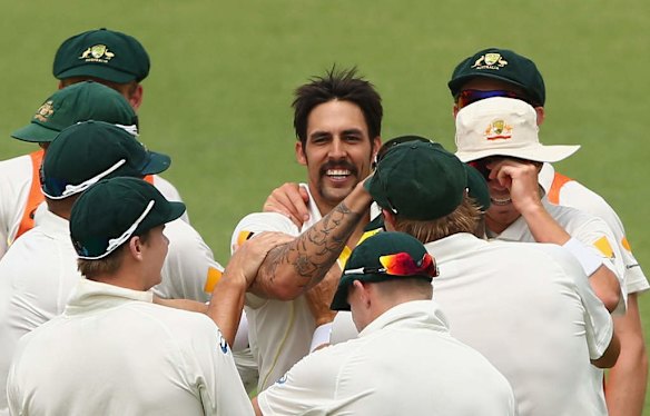 Mitchell Johnson of Australia celebrates with Chris Rogers after they combined to dismiss Tim Bresnan of England during day five of the Third Ashes Test Match.
