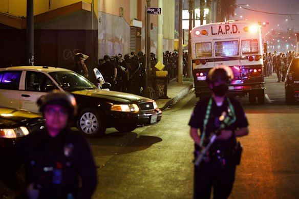 Los Angeles Police Department (LAPD) officers detain demonstrators after declaring an unlawful assembly on election night in Los Angeles, California, U.S.
