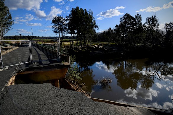 Destroyed bridge splits community already suffering amid flood recovery