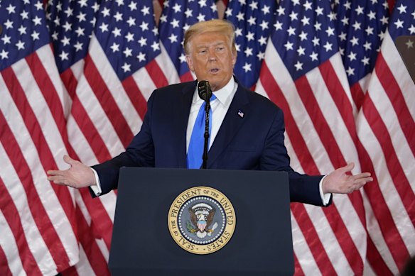 President Donald Trump speaks in the East Room of the White House in Washington.