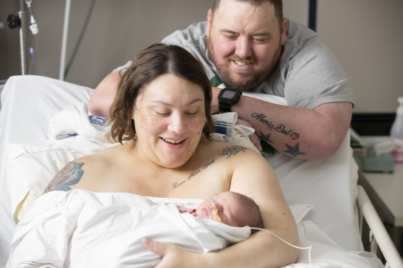 Cassie Woods, pictured above left, and Chris Woods, pictured above right, welcome their son Declan into the world on Christmas morning.