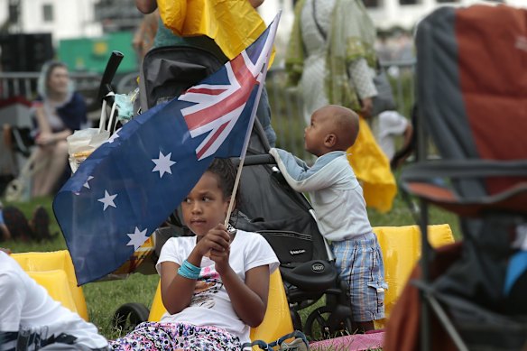  Akon Baak, 7, of Crystalbrook playing with an Australian flag with brother Yuew Baak, 1.