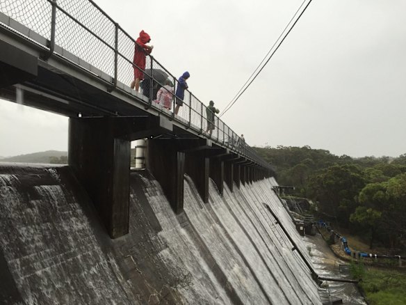 The Manly Dam spilling over on Wednesday morning. 