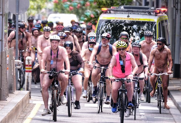 Nude cyclists ride through the city of Melbourne during the World Naked Bike Ride.