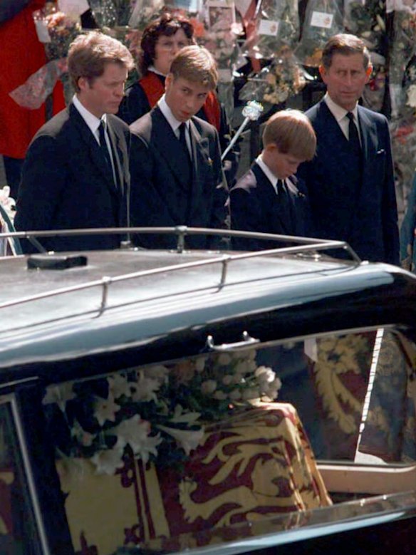 From left, Earl Spencer, Prince William, Prince Harry and then-Prince of Wales Charles watch as Diana’s coffin leaves Westminster Abbey following her funeral in 1997.
