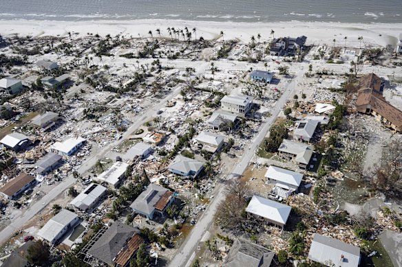 Aerial photo shows damaged homes and debris in the aftermath of Hurricane Ian at Fort Myers Beach, Fla. (AP Photo/Wilfredo Lee)