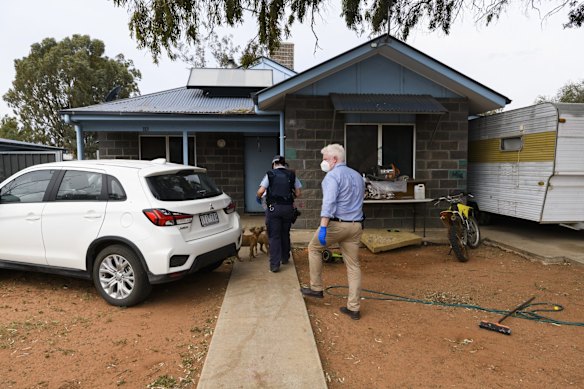 Police officers Cameron Whiteside and Hayley Simshauser deliver food parcels to Wilcannia residents who are isolating at home to stop the spread of COVID-19.