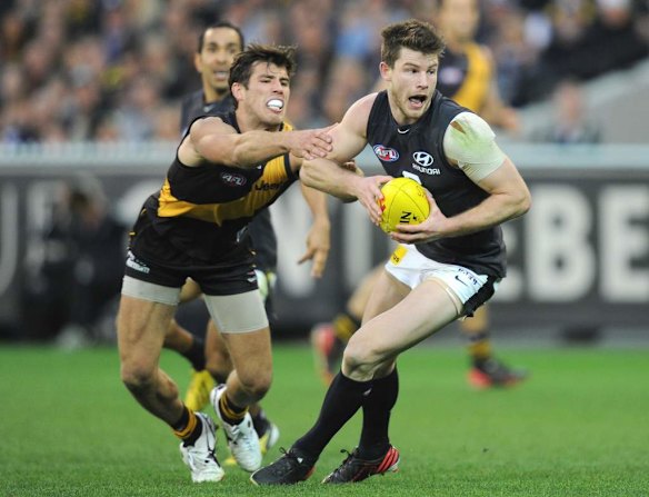 Richmond's Alex Rance chases Carlton's Bryce Gibbs.