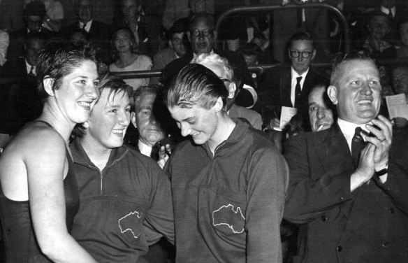 Dawn Fraser, Lorraine Crapp and Faith Leech after they placed 1st, 2nd and 3rd in the 100-metres freestyle.