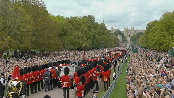 The Long Walk in Windsor is lined with tens of thousands of mourners gathered to welcome the Queen home to her final resting place.