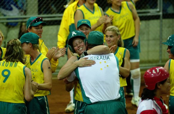 Peta Edebone is mobbed at home plate after hitting the winner against China at Blacktown, guaranteeing Australia a softball medal at the 2000 Olympics.
