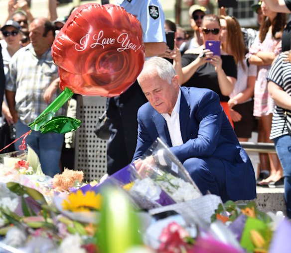 The Prime Minister of Australia Malcolm Turnbull lays flowers at Bourke Street.