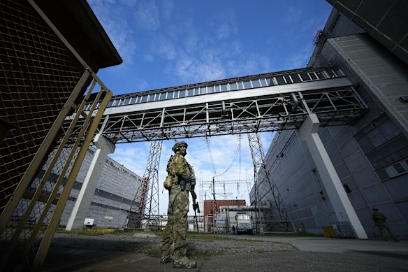 A Russian serviceman guards an area of the Zaporizhzhia Nuclear Power Station in territory under Russian military control, south-eastern Ukraine.