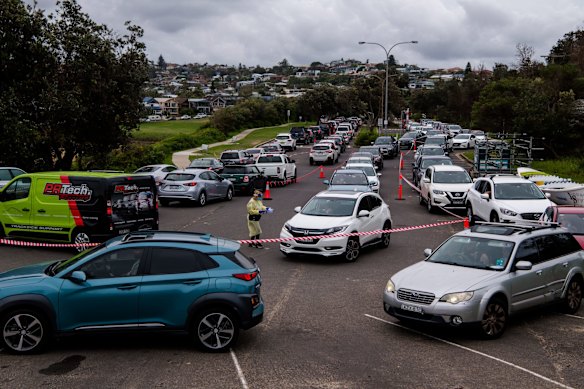 A very busy drive thru COVID-19 testing site at North Curl Curl beach carpark. In just a four-day period, 140,000 coronavirus test results came in from across NSW, more than one-third of them from Sydney's northern beaches. Lines stretched hundreds of metres at some testing clinics where people waited hours to be tested as NSW recorded more daily tests than ever before this week.