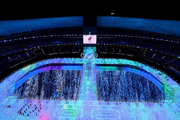 Flag bearers Olga Fatkulina and Vadim Shipachyov of Team ROC carry their flag into the stadium.