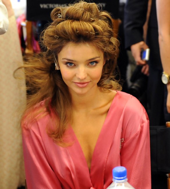 Miranda Kerr gets ready backstage for the Victoria's Secret Fashion Show, Miami, November 2008.